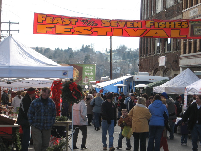 people shopping at tents during a winter outdoor festival