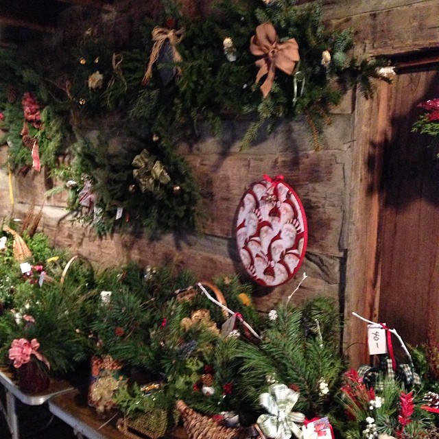 fresh pine arrangements hanging on a wall