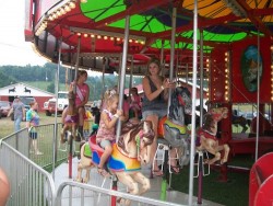 kids riding on a carousel