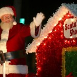 man in Santa suit waving