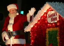man in Santa suit waving