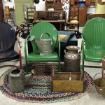 vintage green outdoor chairs and watering cans