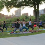 people in a yoga pose outdoors