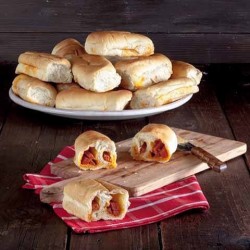 a display of pepperoni rolls with some cut in half