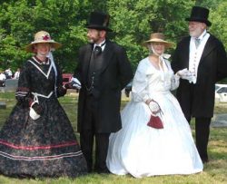 2 men and 2 women dressed in 19th century clothing