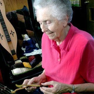 woman playing dulcimer