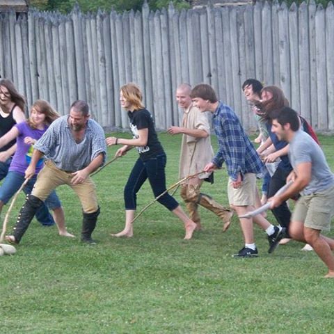 kids playing an 18th century game outside