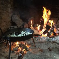 open hearth with fire and skillet