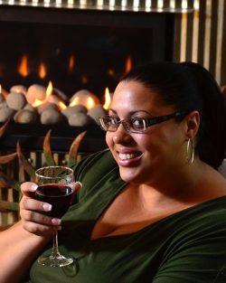 woman holding glass of red wine