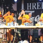 people competing in a pepperoni roll eating contest