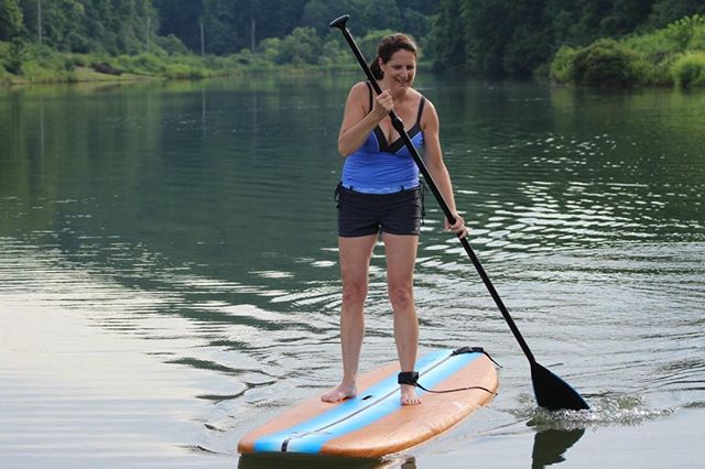 woman on a stand up paddle board