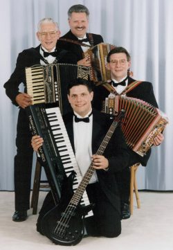 four members of a family polka band holding accordions