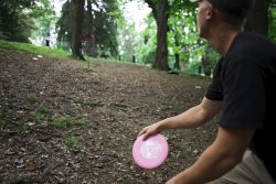 man throwing a Frisbee-like disc