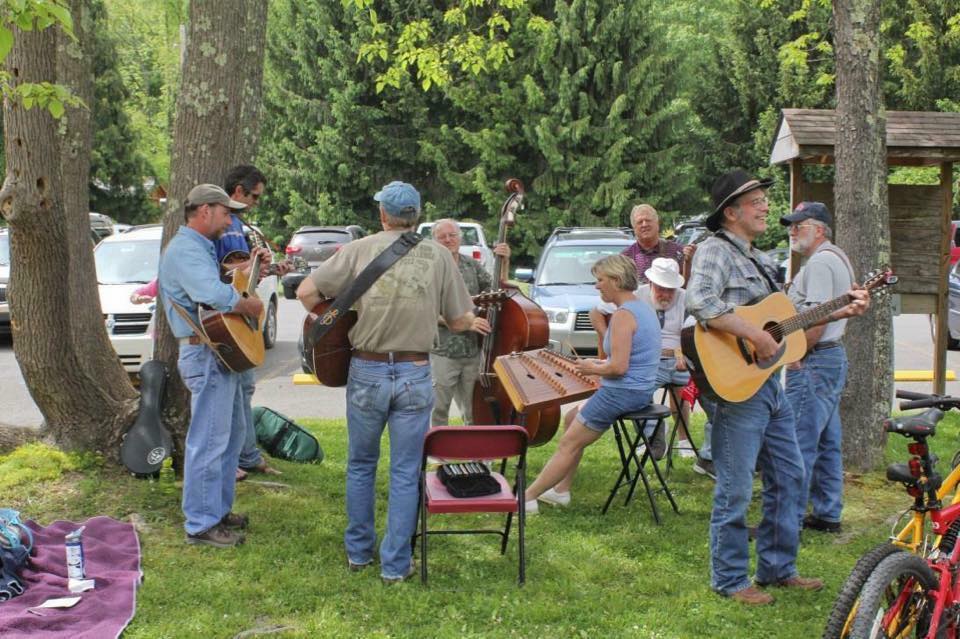 people playing instruments outdoors in front of fort