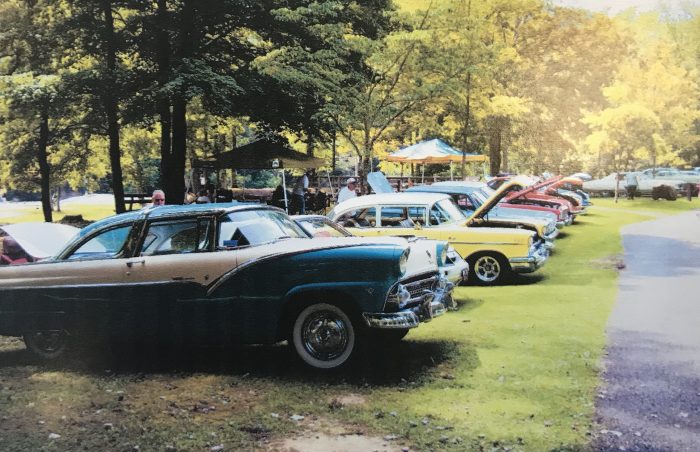 antique cars on display in park