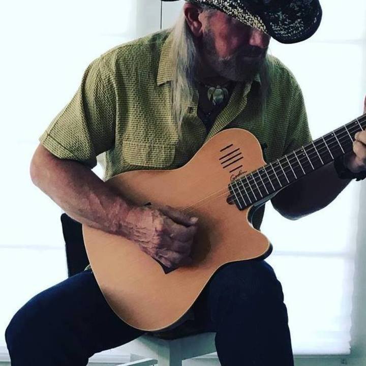 Greg Short playing guitar