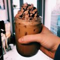 glass of iced coffee with chocolate whipped cream