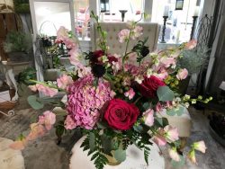 fresh floral arrangement of red and pink flowers