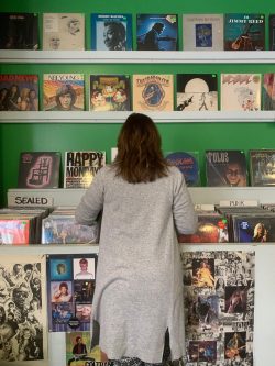 woman looking a albums in a record store