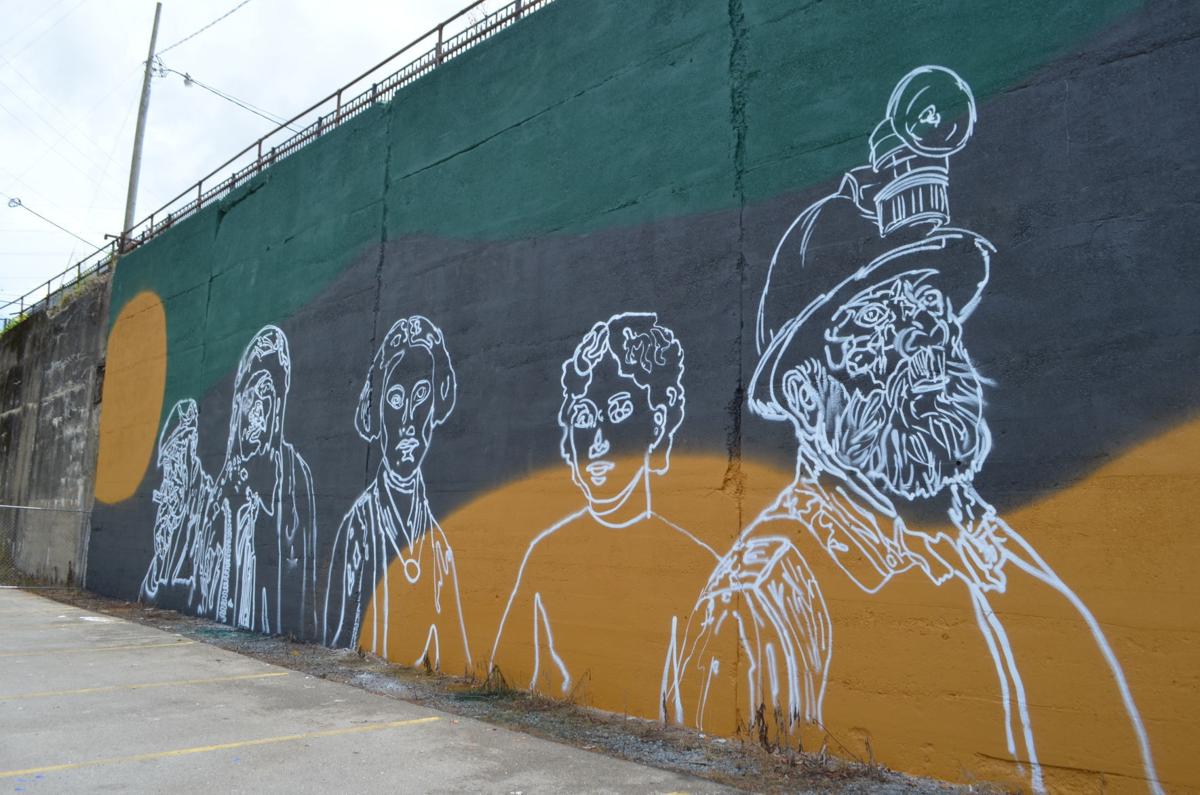 mural of 5 white outlines on a black and orange background