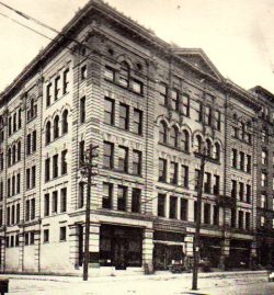 old picture of a five story building