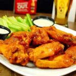 plate of wings, celery and ranch dressing