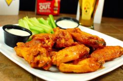plate of wings, celery and ranch dressing