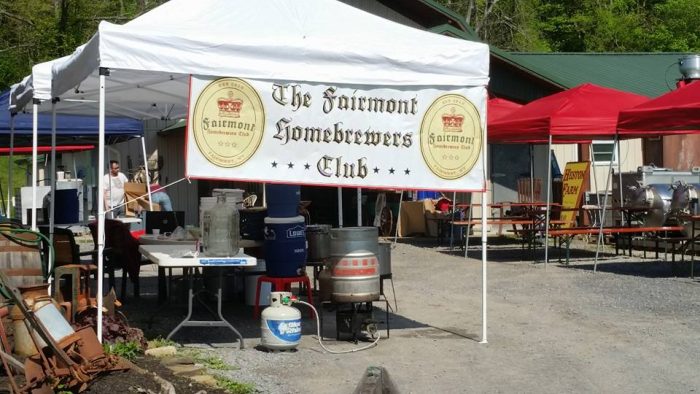 white tent with a banner that reads The Fairmont Homebrewers Club