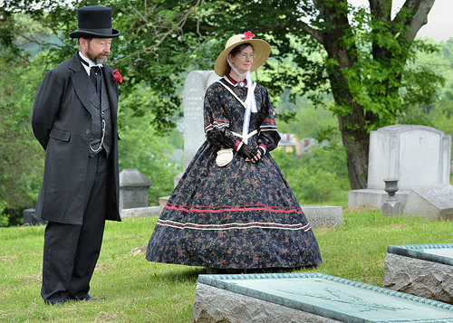 male and female reenactors dressed in civil war era costumes