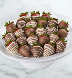 a plate of chocolate covered strawberries
