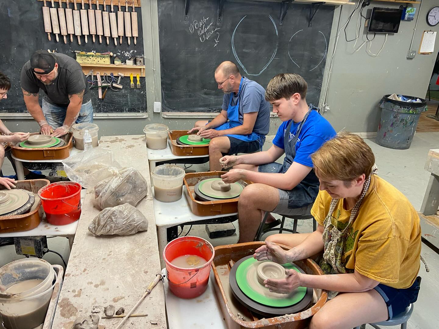 Photo of people throwing pottery